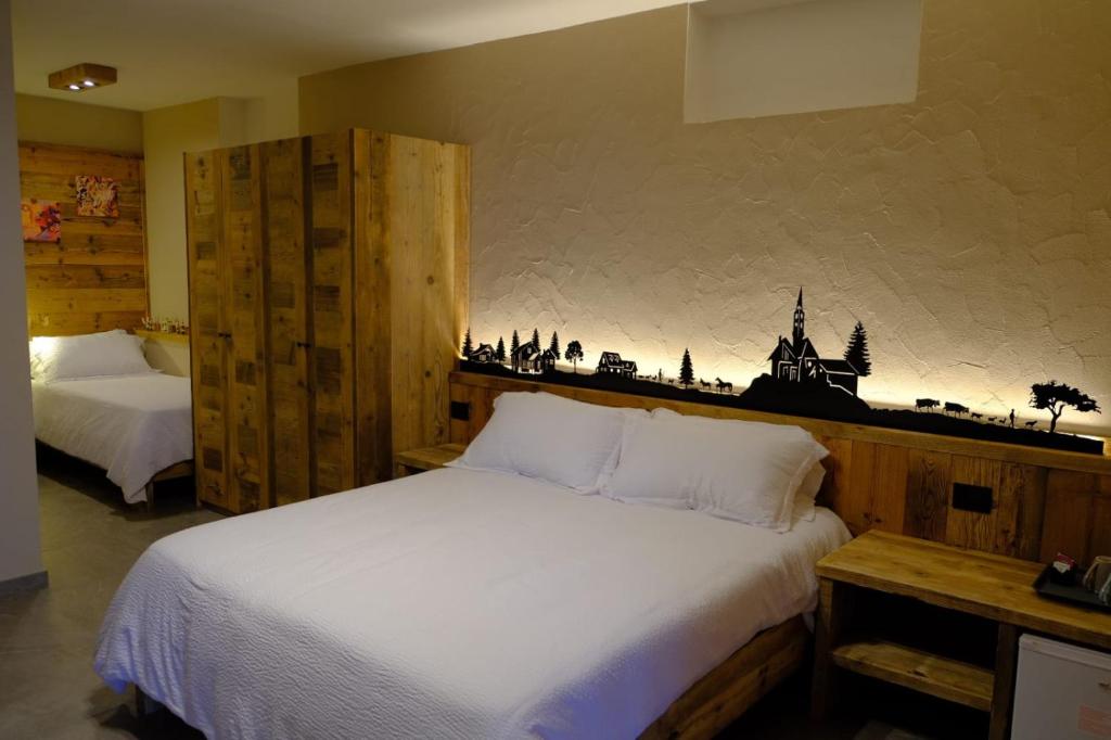 Postel nebo postele na pokoji v ubytování Arlette Chambres d'Hôtes