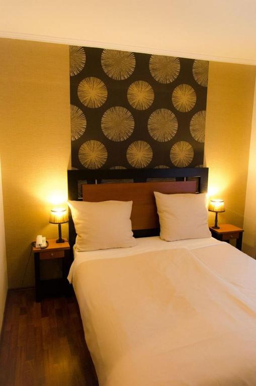 Postel nebo postele na pokoji v ubytování Hotel Borchers