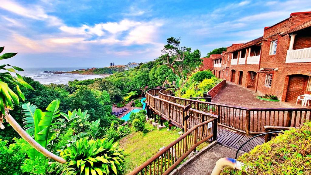 a resort balcony with a view of the ocean at Seaglen Dunes Resort in Port Edward