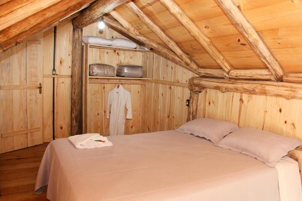 Postel nebo postele na pokoji v ubytování Chalé Refúgio Panorâmico