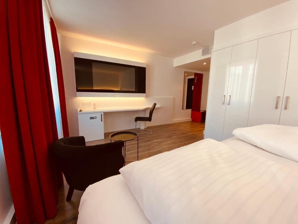 Giường trong phòng chung tại DORMERO Hotel Dresden City