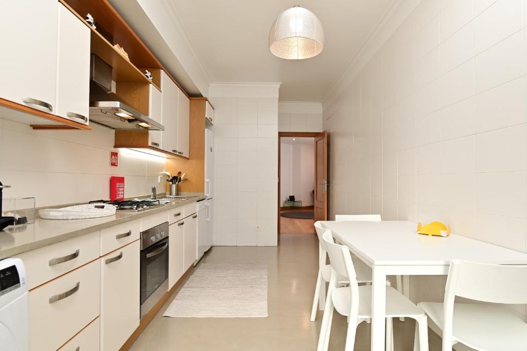 Kuchyň nebo kuchyňský kout v ubytování Columbano Garden, Family Apartment