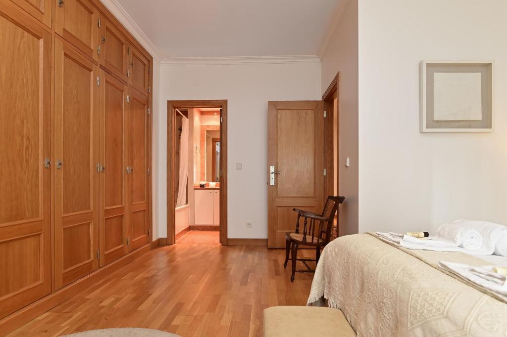 Postel nebo postele na pokoji v ubytování Columbano Garden, Family Apartment