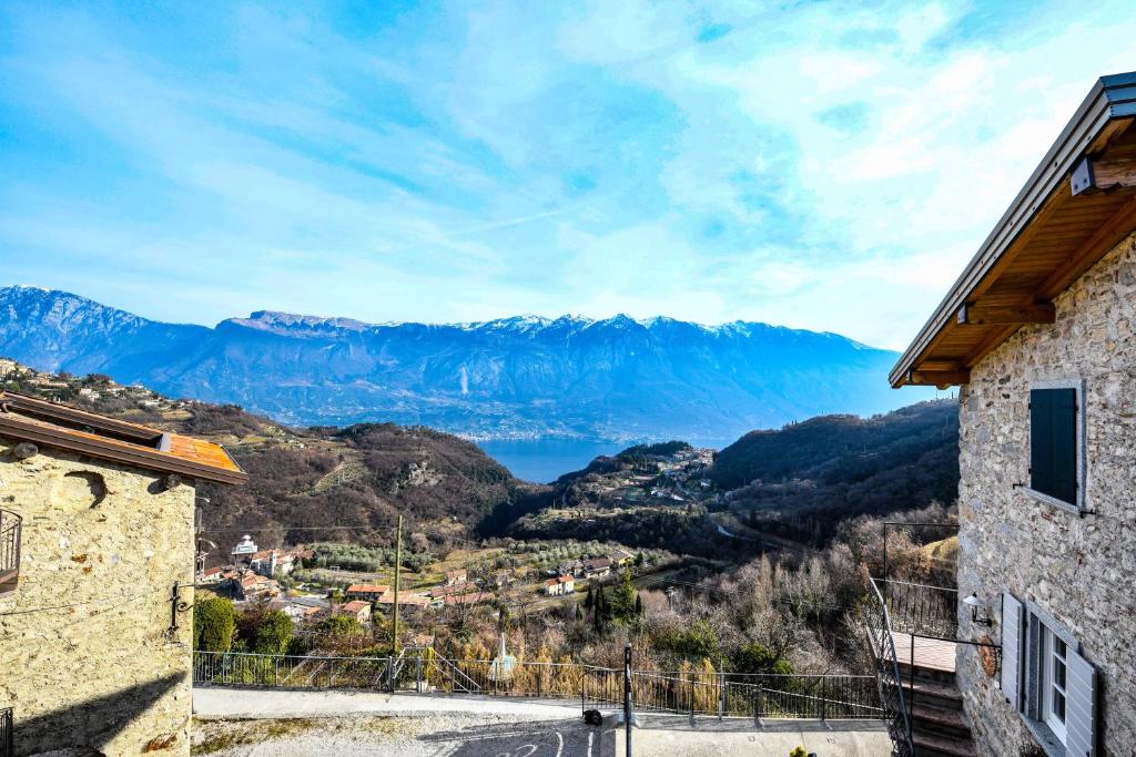 a view of a mountain range from a house at Casa nel Borgo - Casa Oliva in Tremosine Sul Garda