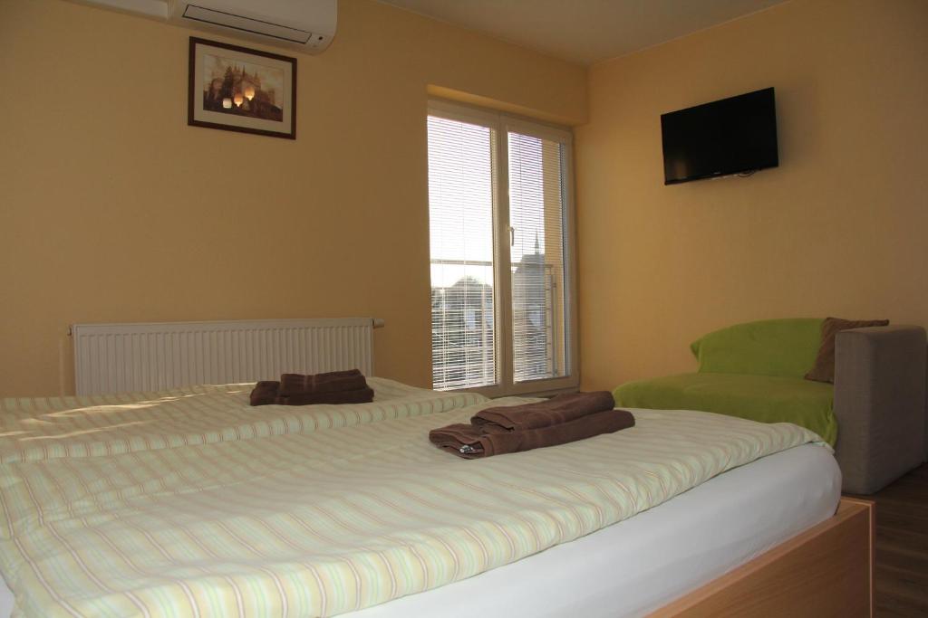Postel nebo postele na pokoji v ubytování Apartmany Hujer