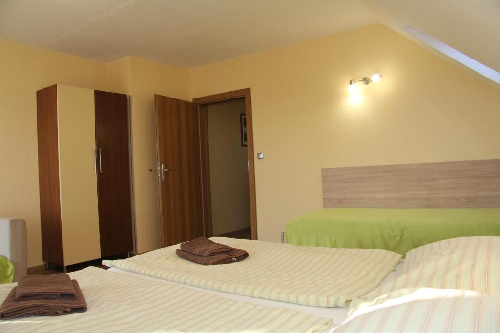 Postel nebo postele na pokoji v ubytování Apartmany Hujer