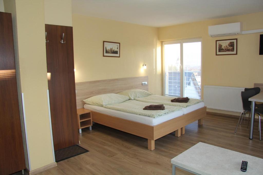 Postel nebo postele na pokoji v ubytování Apartmany Hujer