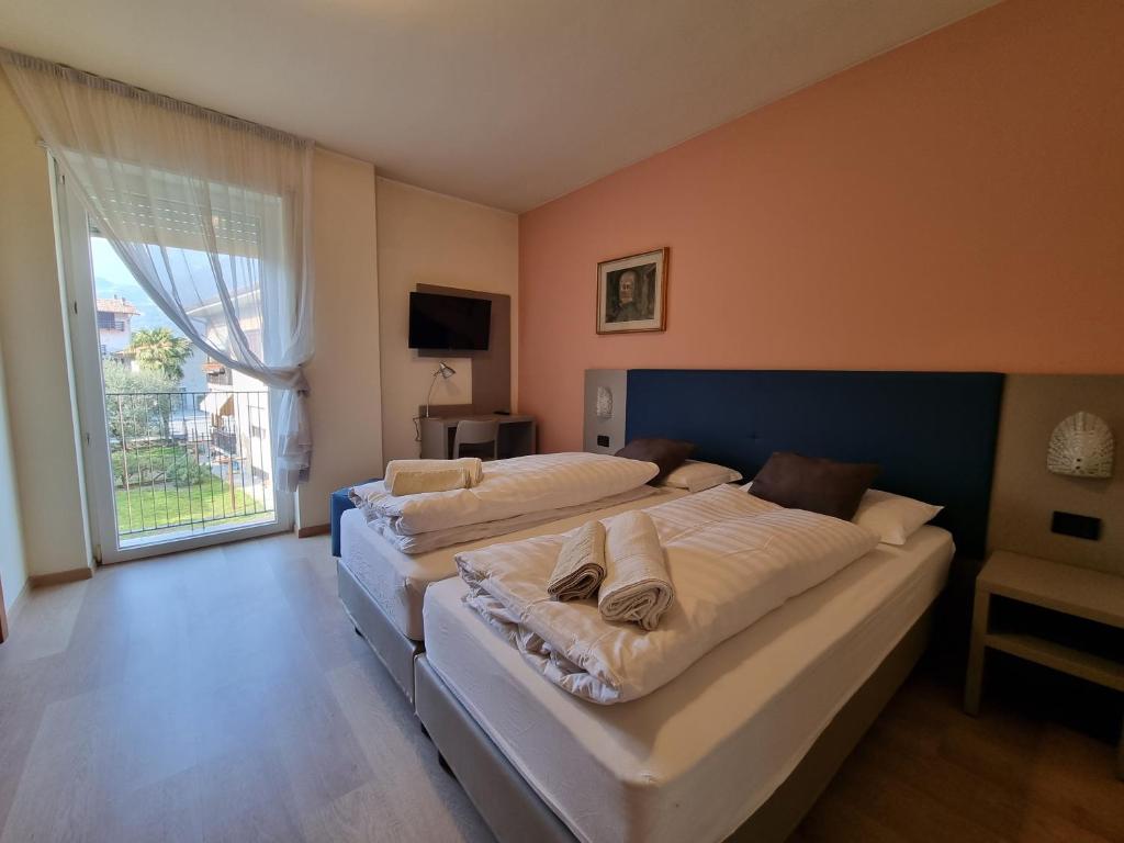 Postel nebo postele na pokoji v ubytování Hotel San Giorgio