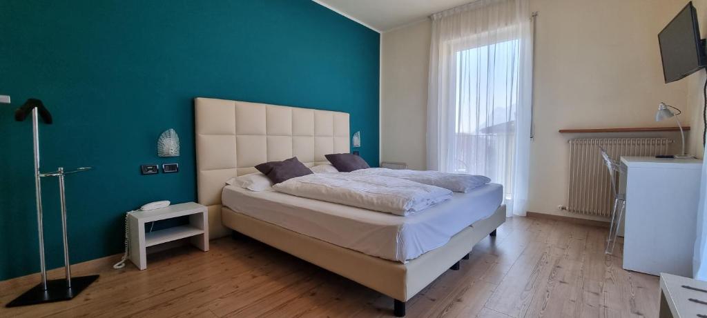 Postel nebo postele na pokoji v ubytování Hotel San Giorgio
