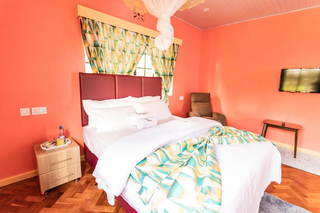 Postel nebo postele na pokoji v ubytování Eldopalm Guesthouse