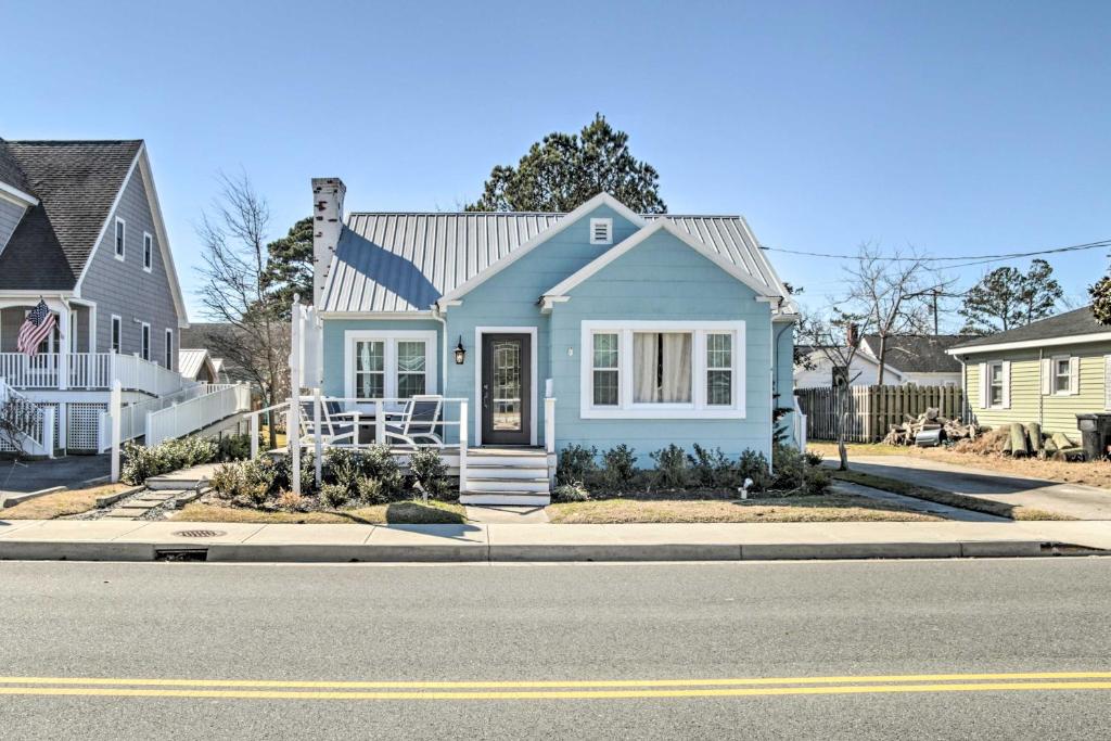 a blue house on the side of the street at Chincoteague Island Cottage about 2 Mi to Beaches in Chincoteague
