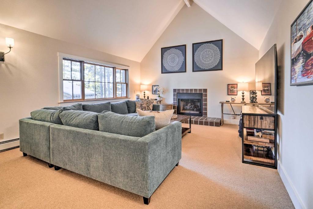 a living room with a couch and a fireplace at Warm Truckee Cabin on Northstar Shuttle Route in Truckee