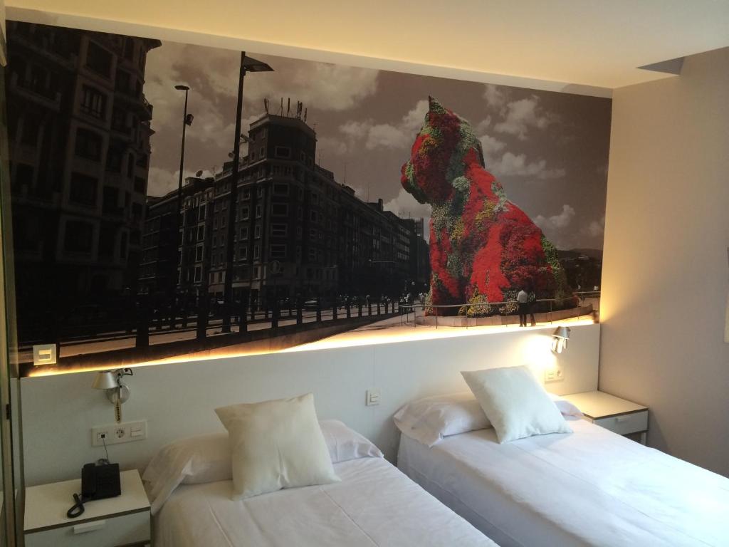 Кровать или кровати в номере Bilbao City Rooms