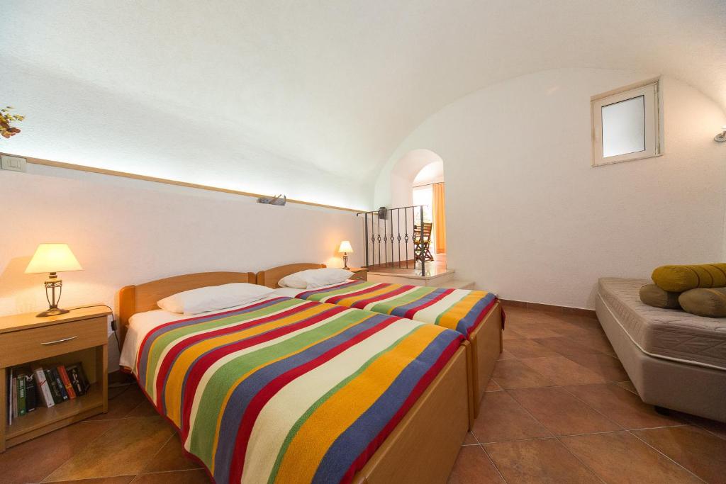 Postel nebo postele na pokoji v ubytování Apartments Benussi