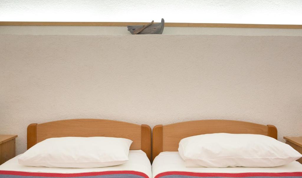 Postel nebo postele na pokoji v ubytování Apartments Benussi
