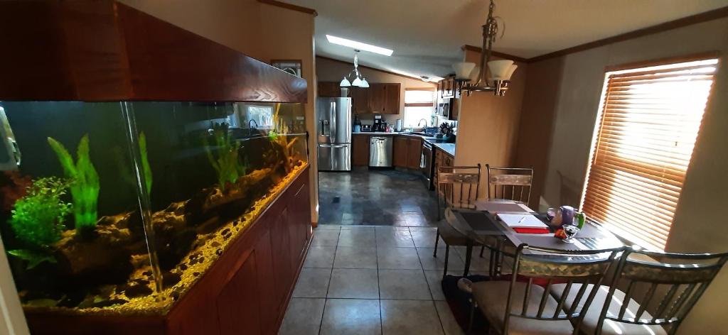 a dining room with a fish tank and a dining table at Private Pet Friendly Home Near Exotic Deer Farm Close to Pigeon Forge, Gatlinburg TN in Sevierville