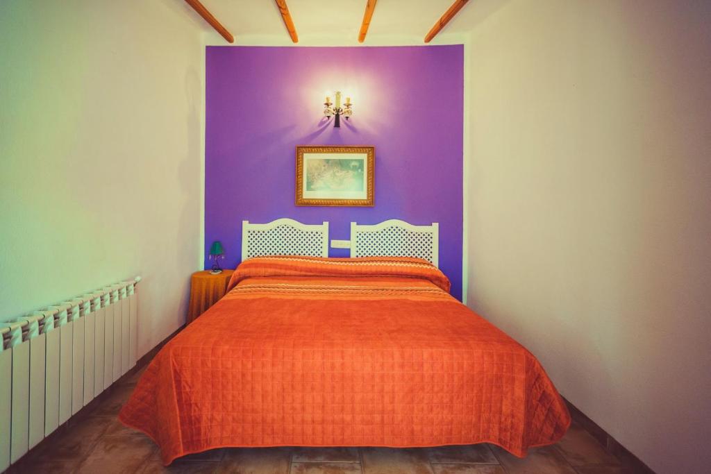 Posteľ alebo postele v izbe v ubytovaní Posada Peñarubia