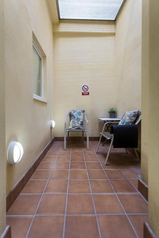 Posezení v ubytování Habitaciones Amelia