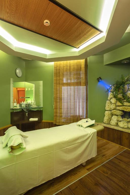 Voodi või voodid majutusasutuse Spa Residence Carbona Great Time Apartman toas
