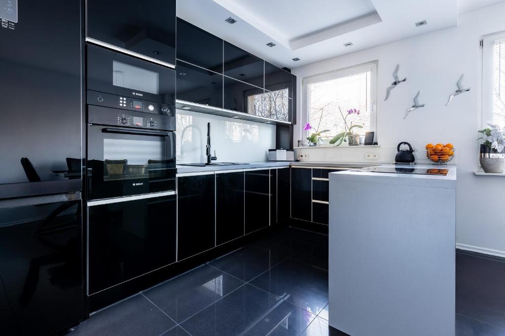 Kuchyňa alebo kuchynka v ubytovaní Apartament SunForYou 2