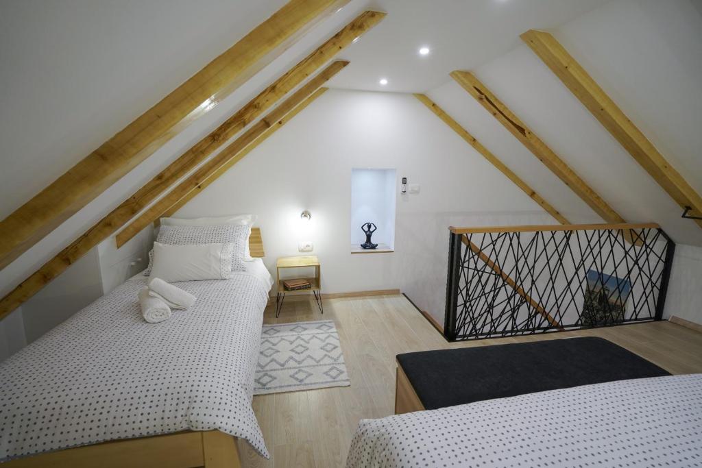 Posteľ alebo postele v izbe v ubytovaní Apartment Ispod ure