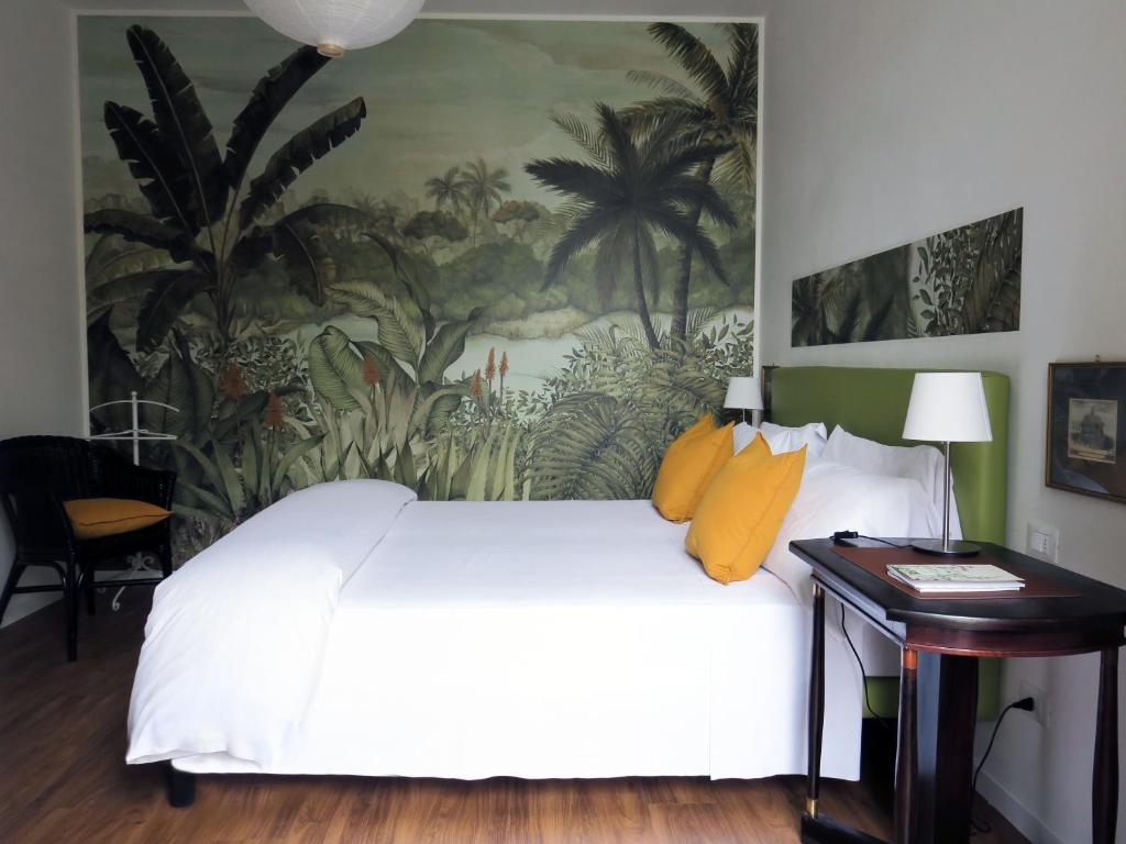 Säng eller sängar i ett rum på Villa Crochat