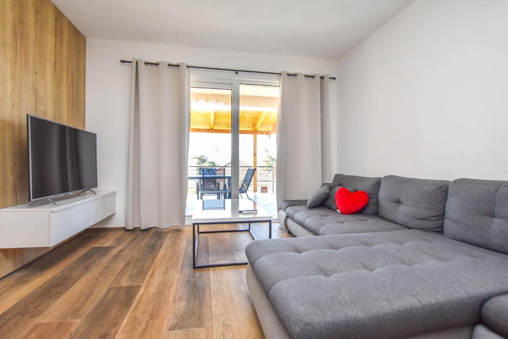 Telewizja i/lub zestaw kina domowego w obiekcie Apartment Sterna