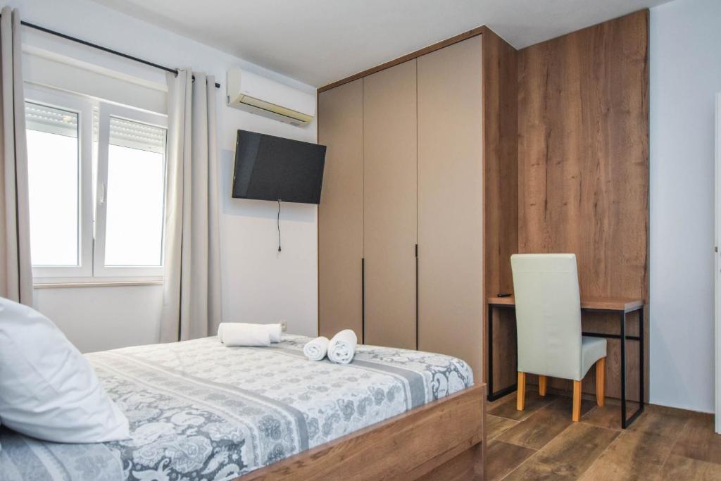 Łóżko lub łóżka w pokoju w obiekcie Apartment Sterna