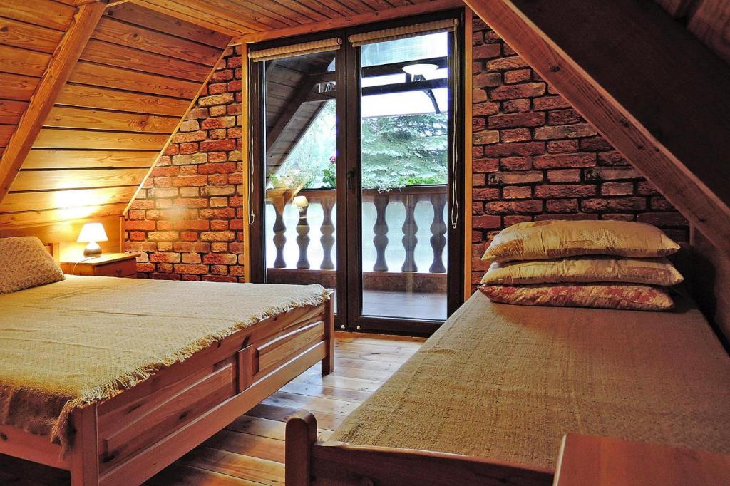 Posteľ alebo postele v izbe v ubytovaní Detached cottage with a large garden, 200m from the lake, Bogacko-ex TUI