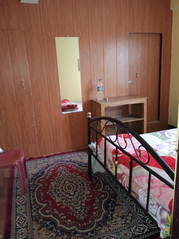 Postel nebo postele na pokoji v ubytování Backpackers Hostel