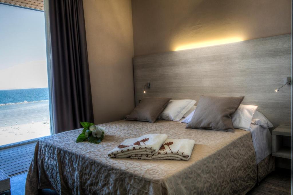 Postel nebo postele na pokoji v ubytování Albergo Aquila