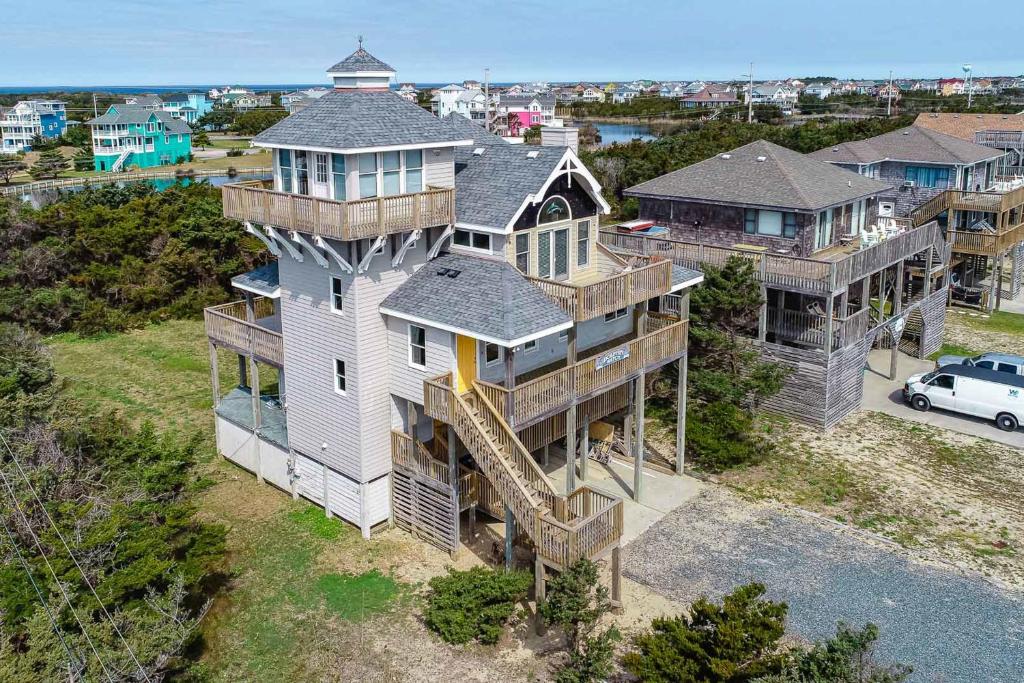 an aerial view of a house with a lighthouse at Dolphin Watch Avon 413 in Avon