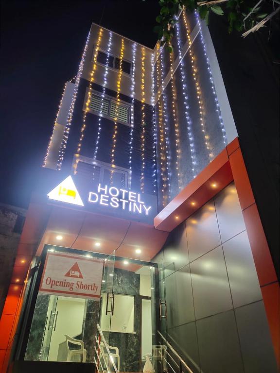 a hotel sign with lights on top of a building at Hotel Destiny in Visakhapatnam
