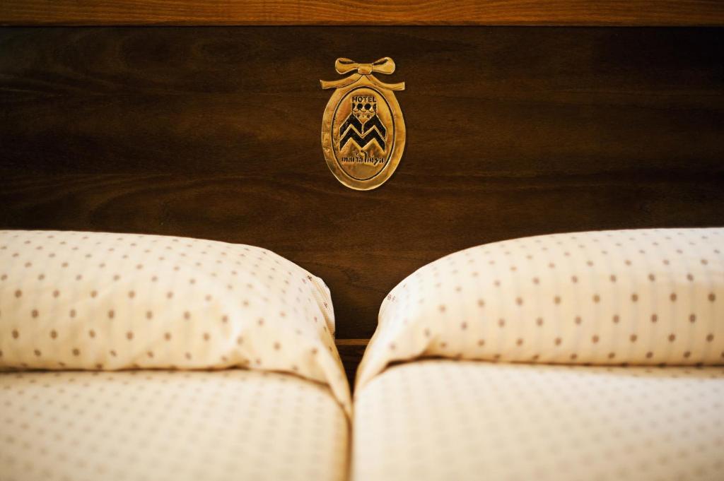 Postel nebo postele na pokoji v ubytování Hotel Maria Luisa