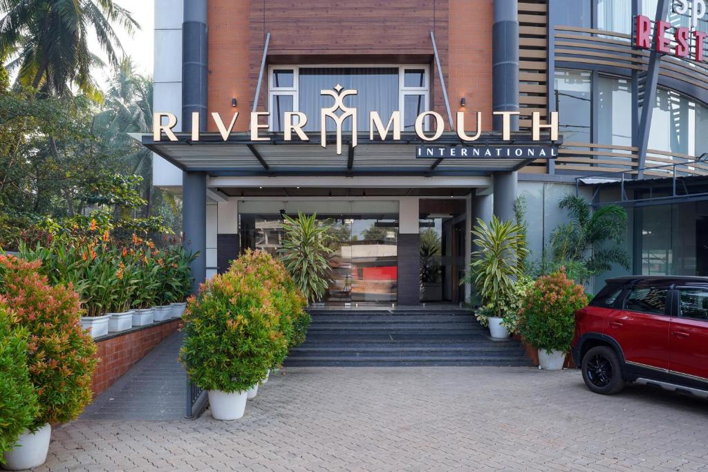 a building with a sign that reads river nourishment at Nexstay River Mouth International in Ferokh