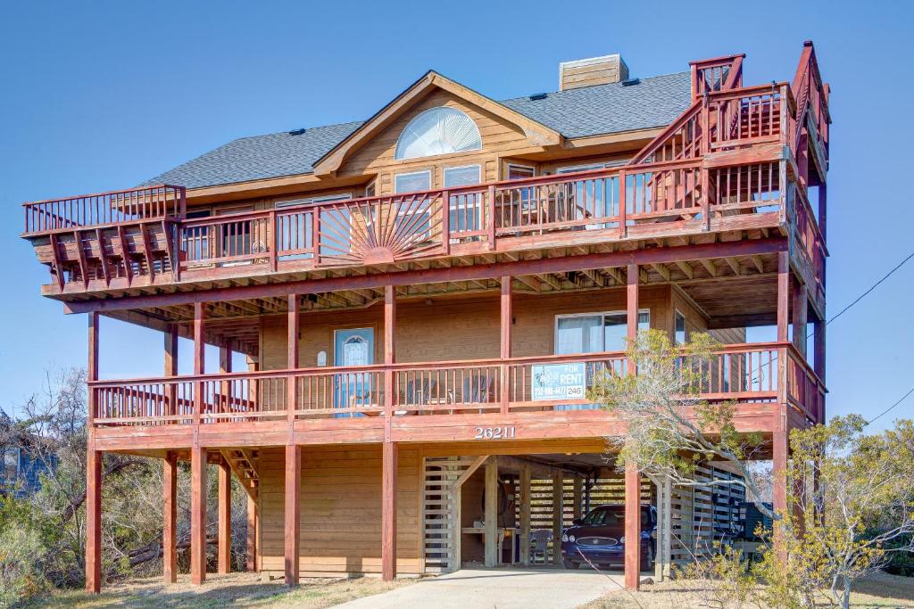 a large wooden house with a wrap around deck at Sandy Cay 246 in Salvo