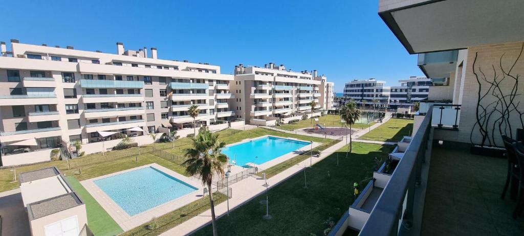 an aerial view of a building with a swimming pool at Excellent location- Beach, Pool, Telework, 2 Bikes, Parking & Wifi GRATIS at "CaSa Carol'S" in Torremolinos