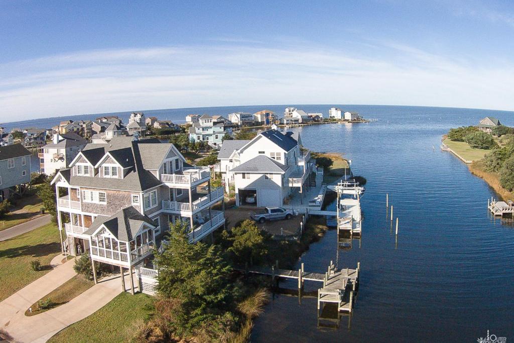 an aerial view of a large house on the water at Spy Dog 837 in Frisco