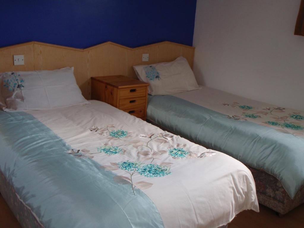Postel nebo postele na pokoji v ubytování Divine Mercy B&B