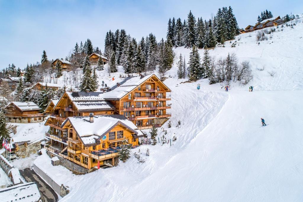 an aerial view of a ski lodge in the snow at Hôtel l'Hélios in Méribel