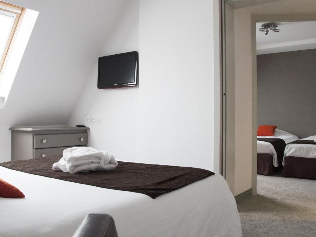 Postel nebo postele na pokoji v ubytování Hotel Restaurant & Spa Verte Vallée