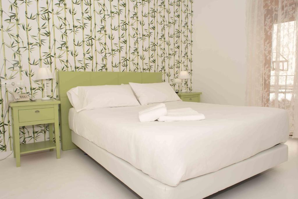 Postel nebo postele na pokoji v ubytování Hotel Almunia