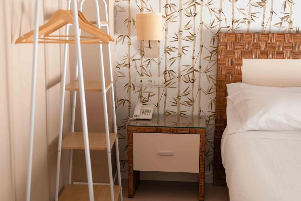 Postel nebo postele na pokoji v ubytování Hotel Almunia