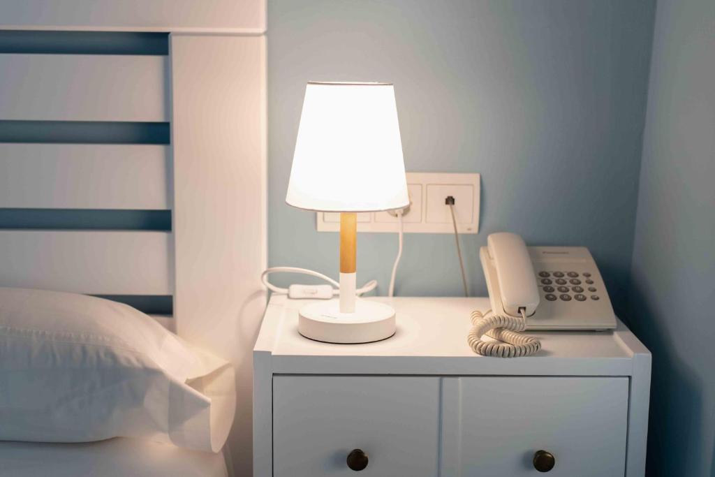 Postel nebo postele na pokoji v ubytování Hotel Almunia