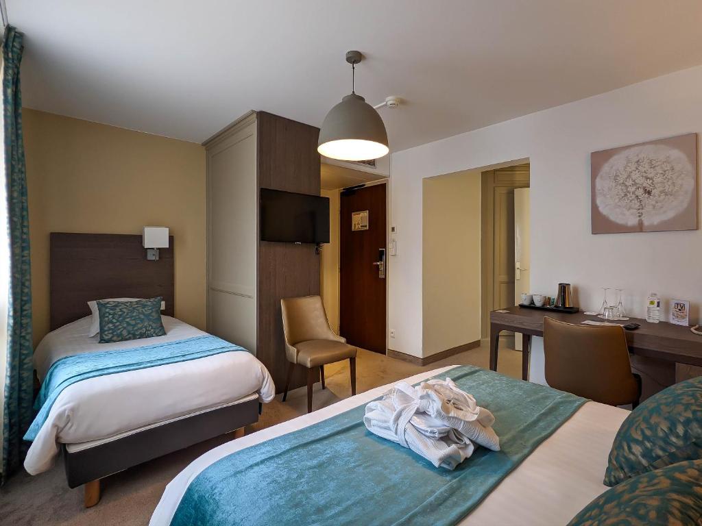 Postel nebo postele na pokoji v ubytování Hotel Restaurant & Spa Verte Vallée
