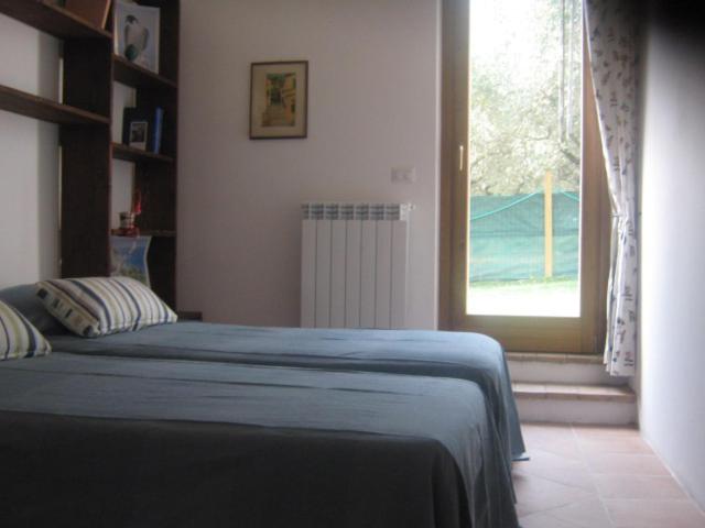 Posteľ alebo postele v izbe v ubytovaní Tra Gli Olivi E La Riviera Del Conero