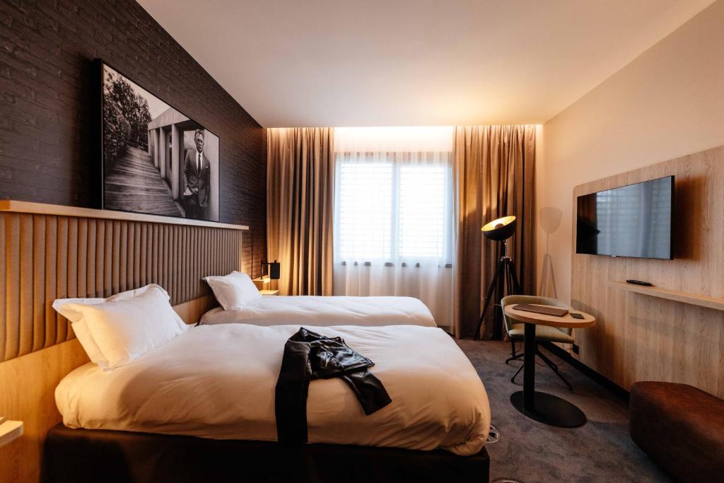 Postel nebo postele na pokoji v ubytování ibis Styles Arras Centre