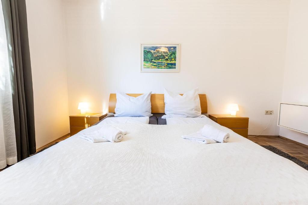 Postel nebo postele na pokoji v ubytování Serviced Appartement München Messe