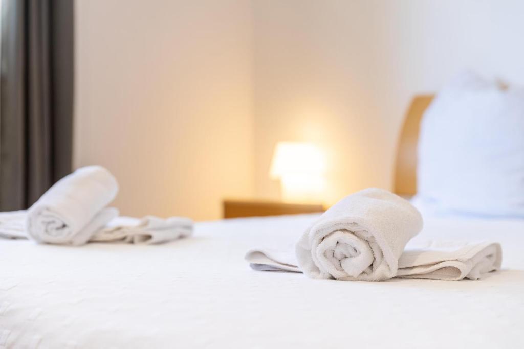 Postel nebo postele na pokoji v ubytování Serviced Appartement München Messe