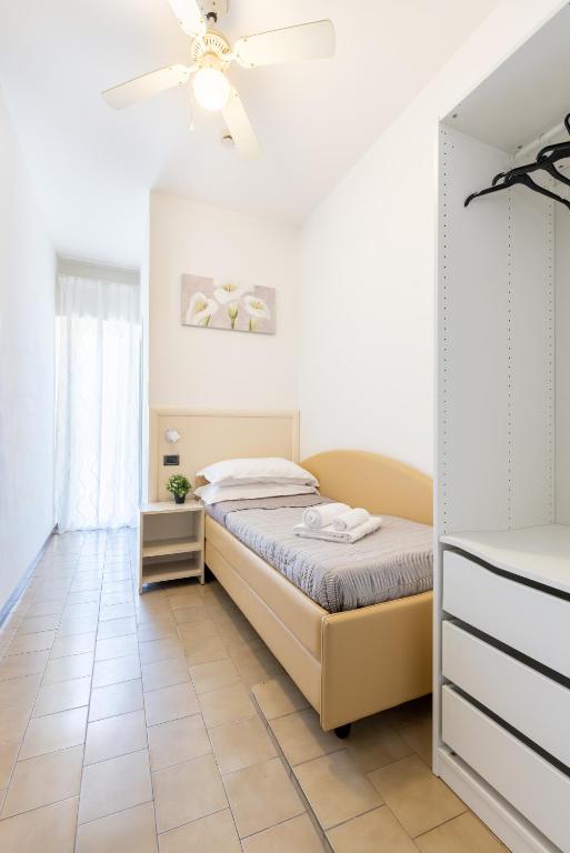 Postel nebo postele na pokoji v ubytování Hotel Mignon Riccione Fronte Mare